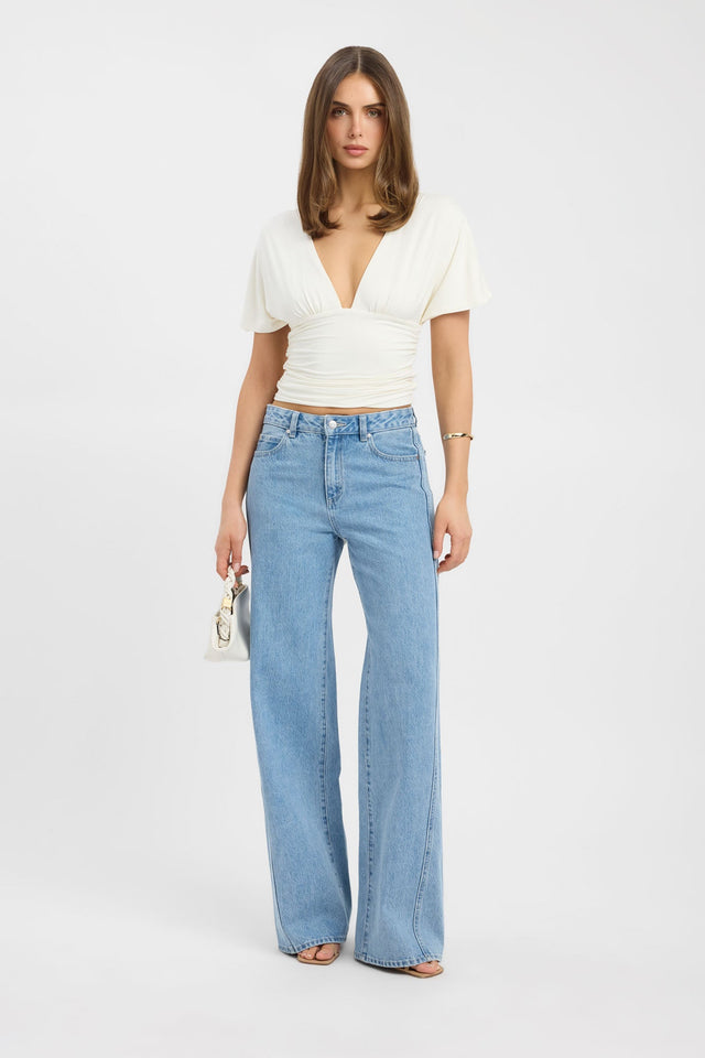 Showcasing the Isla Top womens blouse in ivory with fitted v-neckline and short sleeves front
