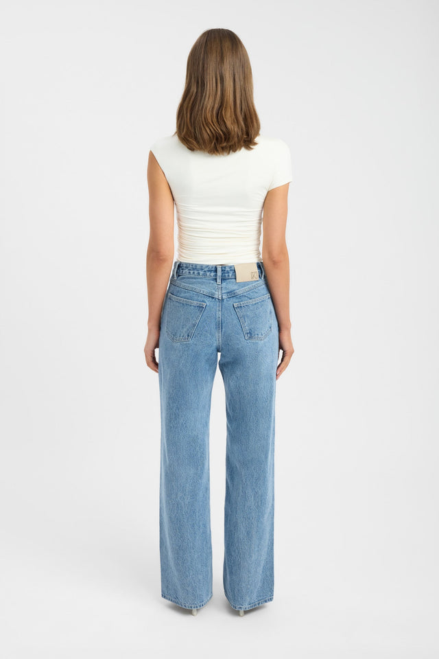 Displaying the Kai Straight Leg Jean in womens regular pants with high-rise light blue back