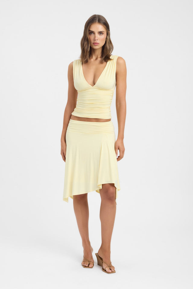 Showcasing the Solis Top womens blouse in light yellow with fitted v-neck sleeveless design on-body