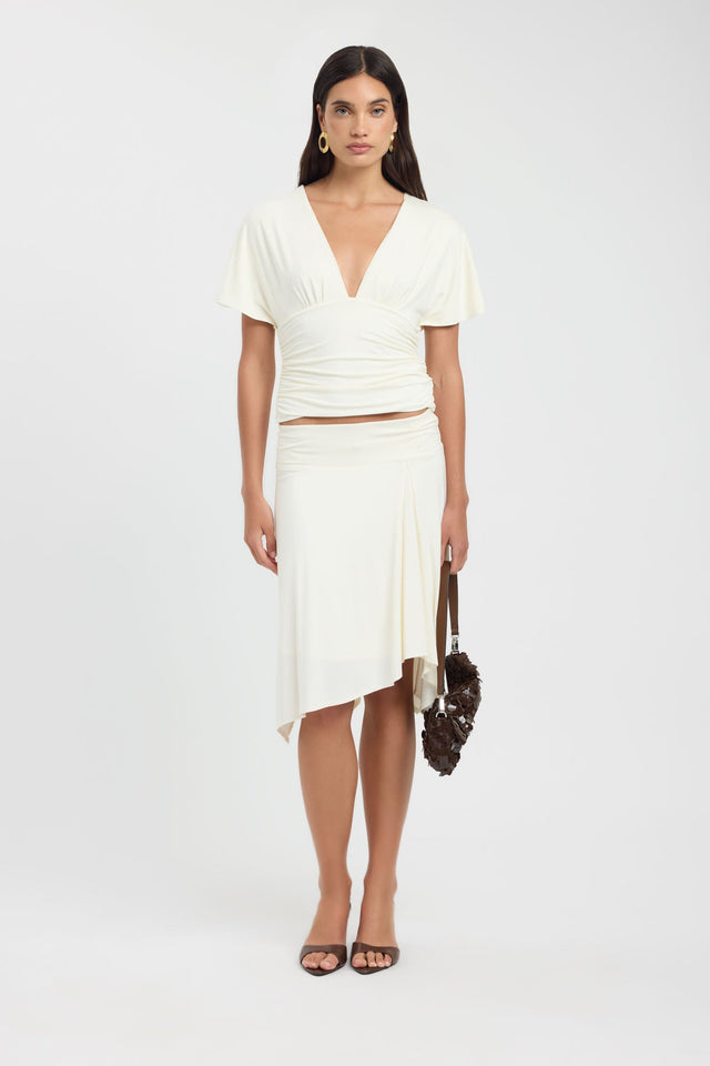 Featuring the Isla Top womens blouse in ivory with fitted v-neckline and short sleeves on-body