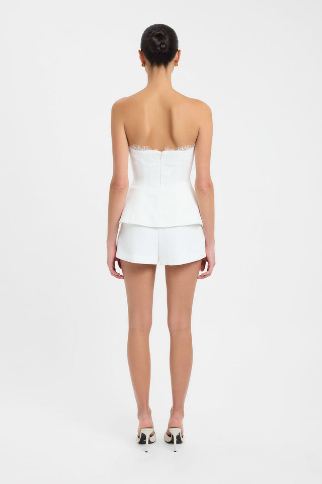 Showcasing the Ariel Strapless Lace Top womens-blouse in white with fitted straight neckline and sleeveless construction side