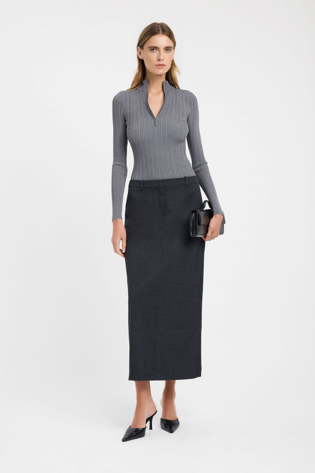 Showcasing the Bristol Zip Top womens blouse in dark grey with fitted silhouette, high-neck design, and full straight sleeves on-body